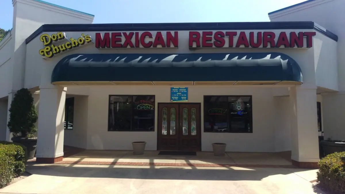Storefront of the original Don Chucho's Mexican Restaurant with a green awning